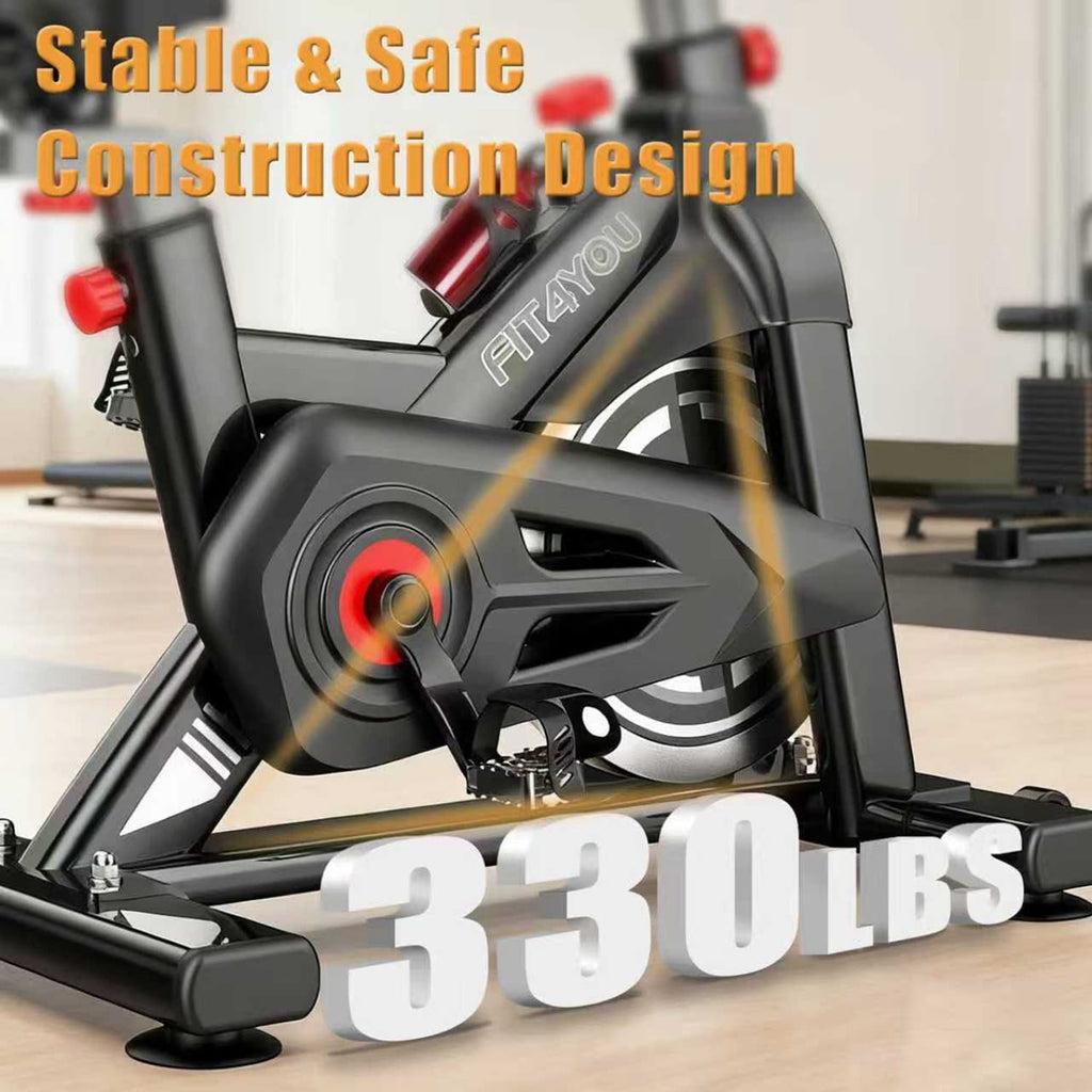 Fitness bike with text highlighting stable and safe construction design and weight capacity.