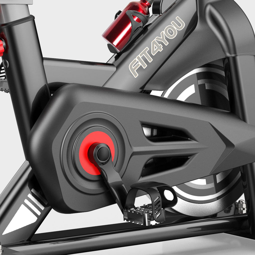 Close-up of a Fit4You fitness bike with a focus on the gear and brand name.