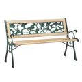 Wooden garden bench with decorative metal backrest on a white background