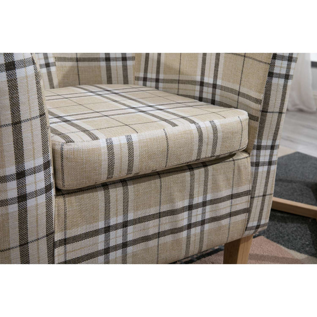 Cream checkered tub chair with a neutral color scheme