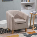 Cream tub chair in a room with a bookshelf and small table.