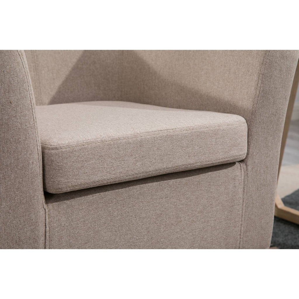 Close-up of a cream tub chair with a soft texture.