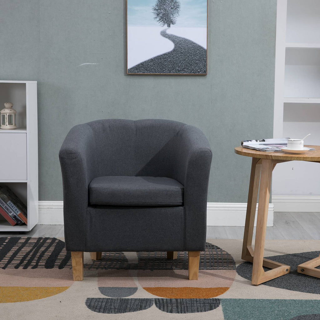 Grey tub chair in a living room setting.