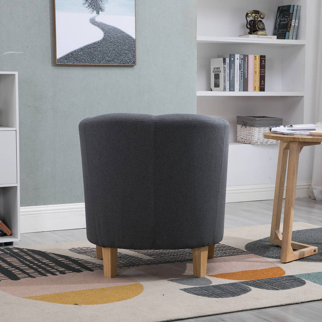 Back view of a fabric grey tub chair in a living room setting.
