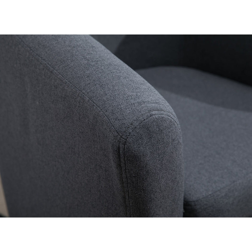 Corner of a fabric grey tub chair.