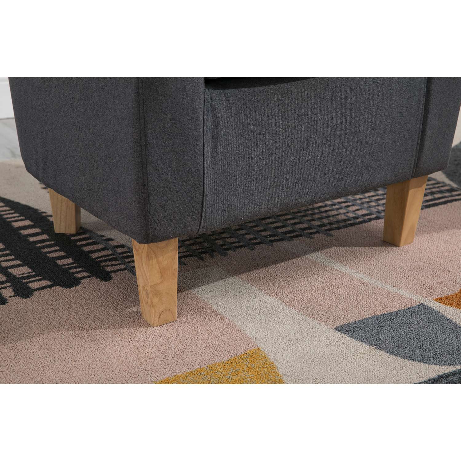 Foot stools of a grey fabric tub chair