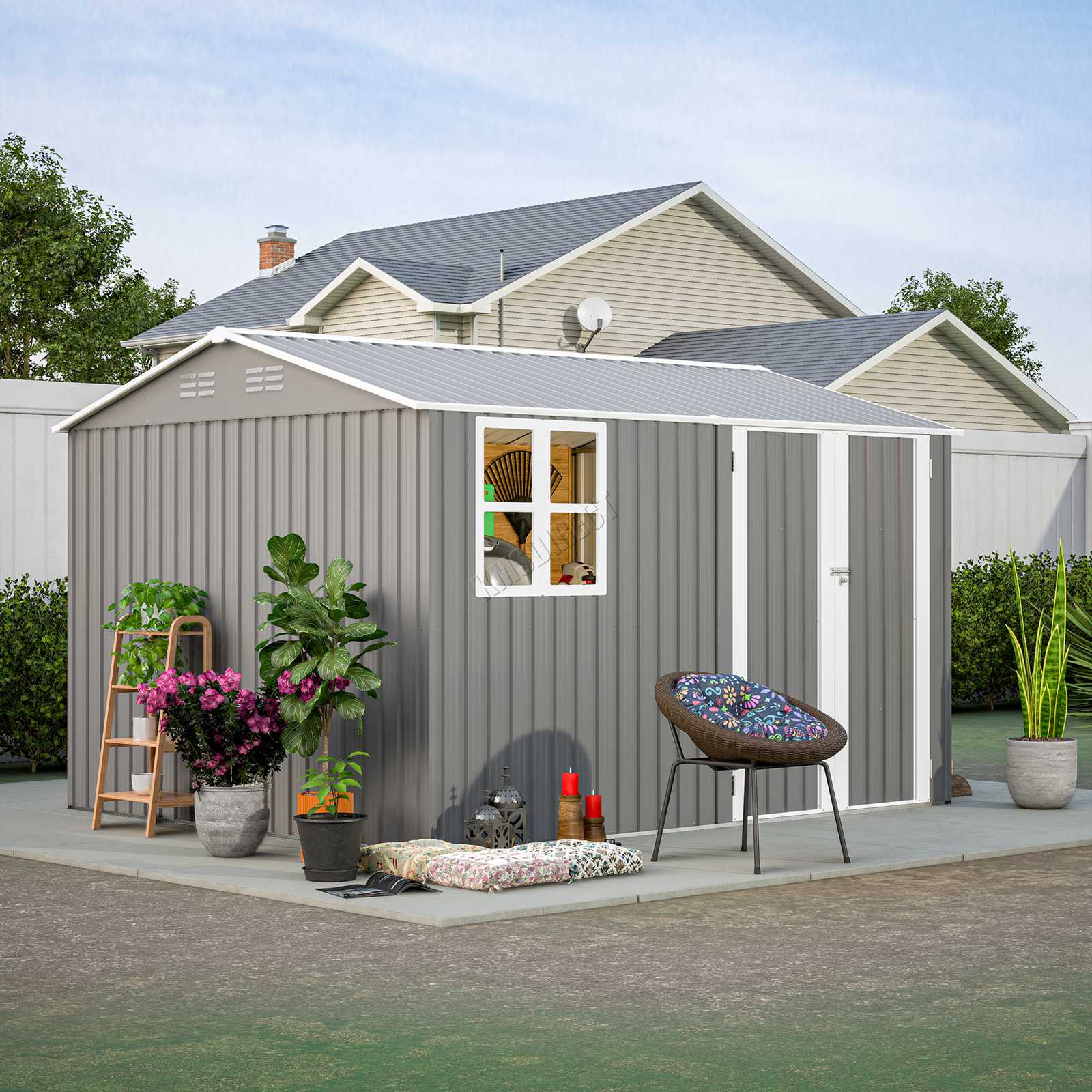 Metal garden shed with a small patio area featuring outdoor furniture and plants.