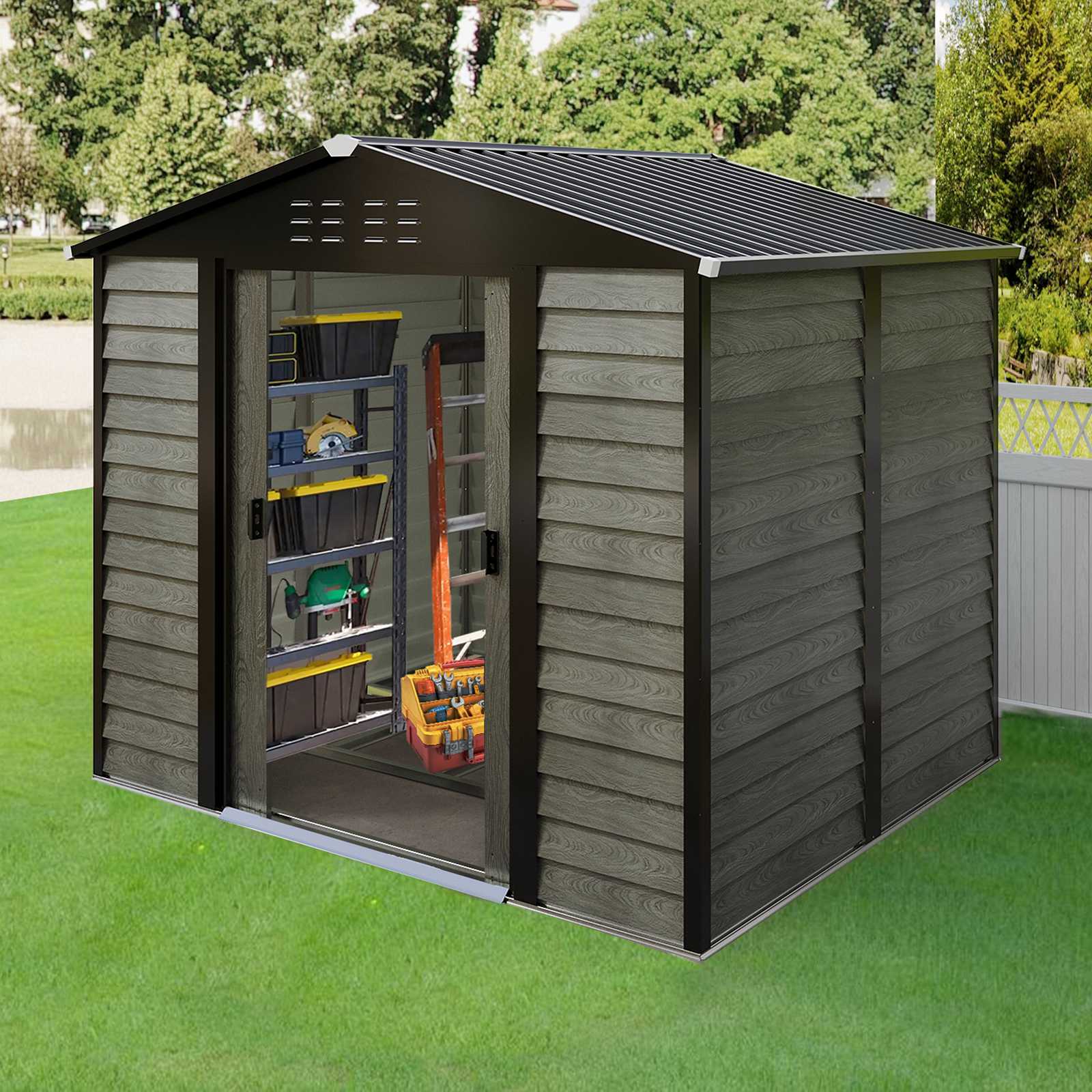 Grey outdoor storage steel shed with tools and equipment on shelves, surrounded by green grass and trees.
