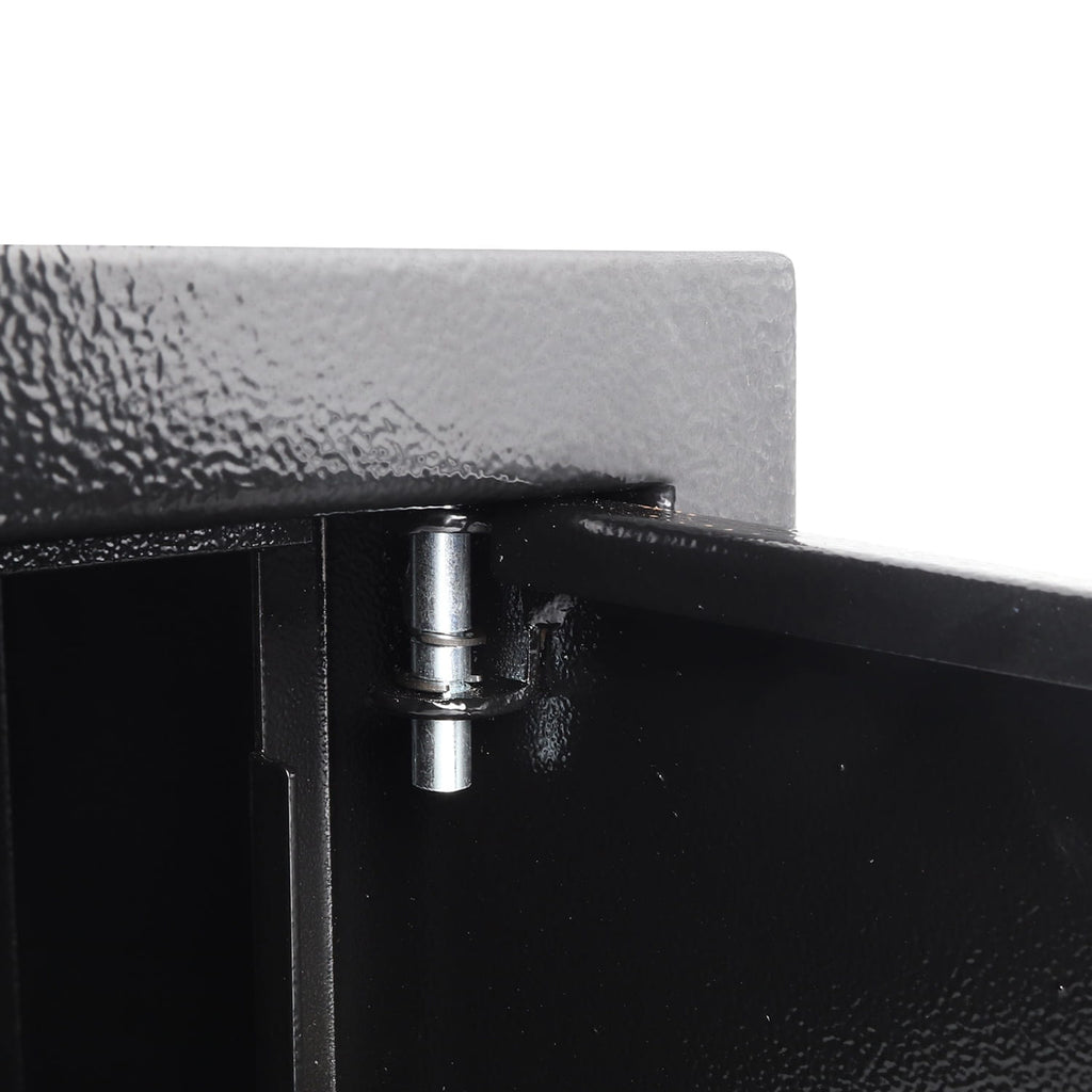 Close-up of a metal hinge on a black metal surface with a white background