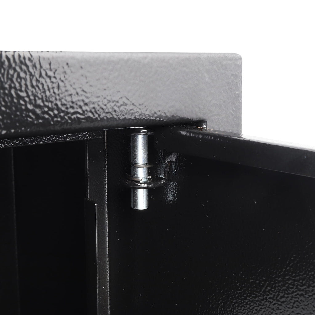Close-up of a metallic hinge on a black metal surface