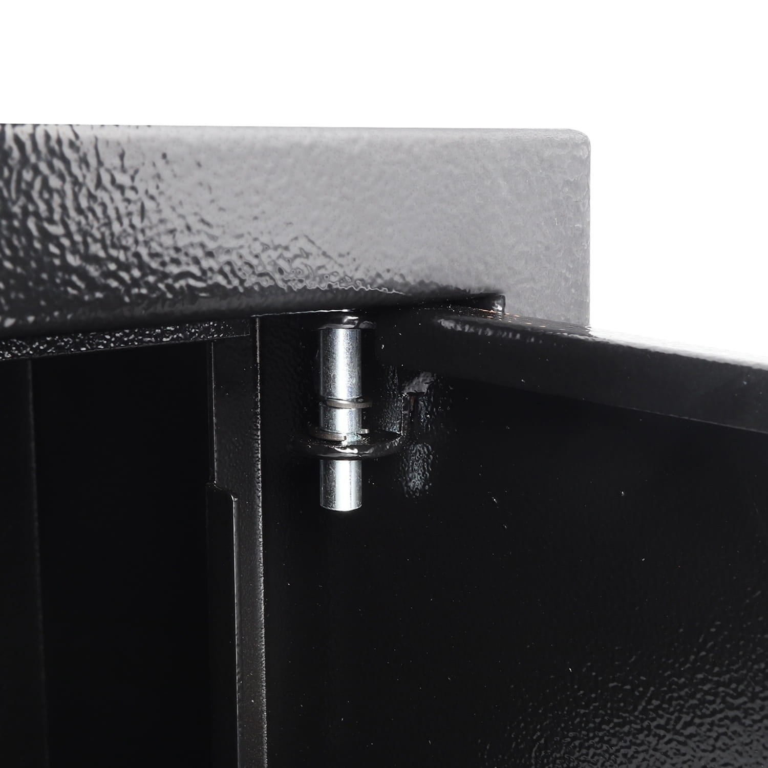 Close-up of a metallic hinge on a black metal surface