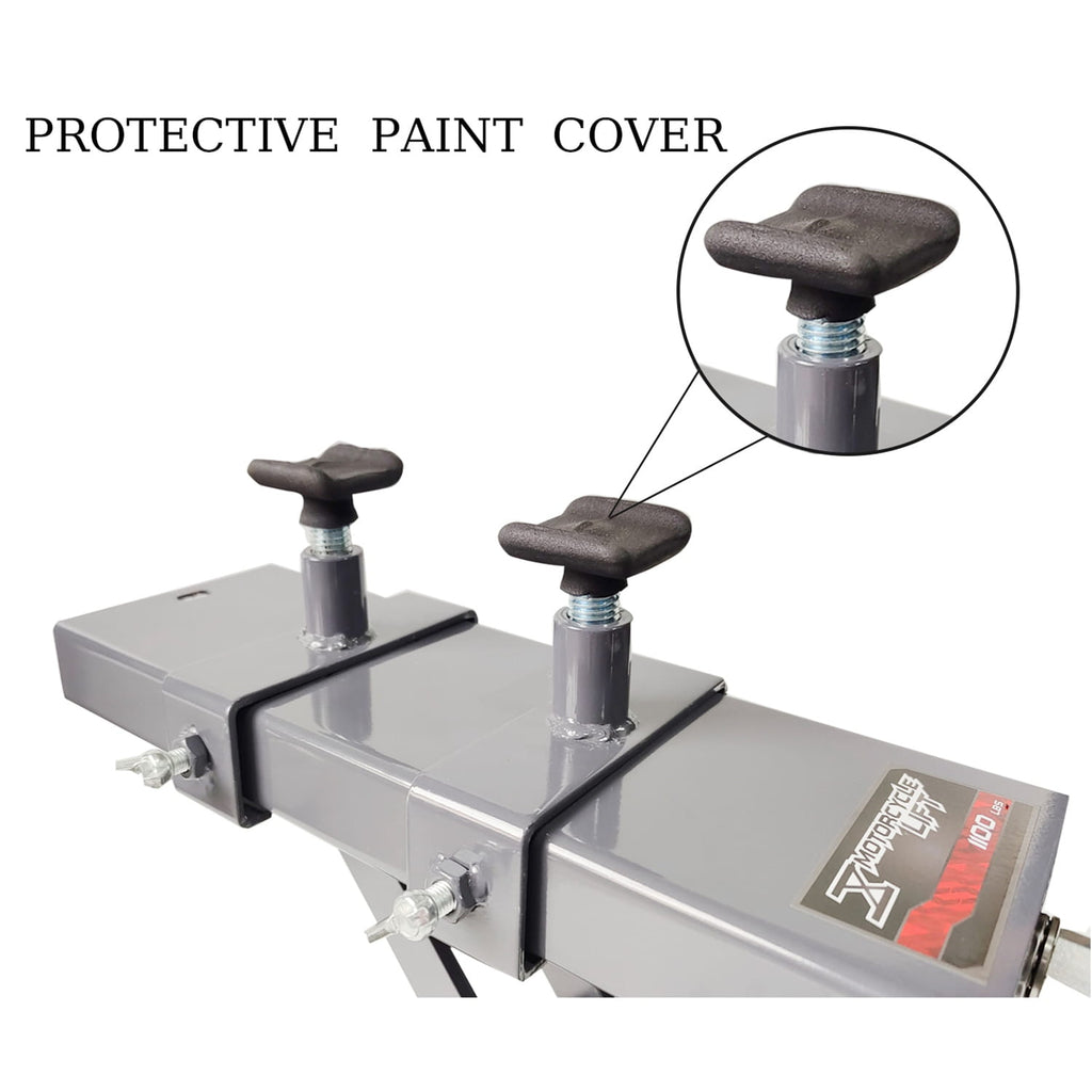 Metal motorbike scissor lift with protective paint cover and close-up of knobs on a white background