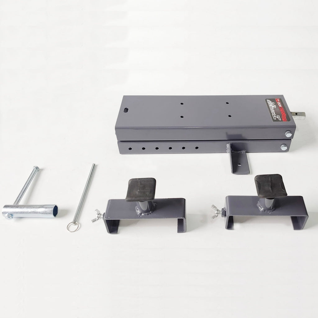 Set of metal brackets and components from a motorbike scissor lift on a white background