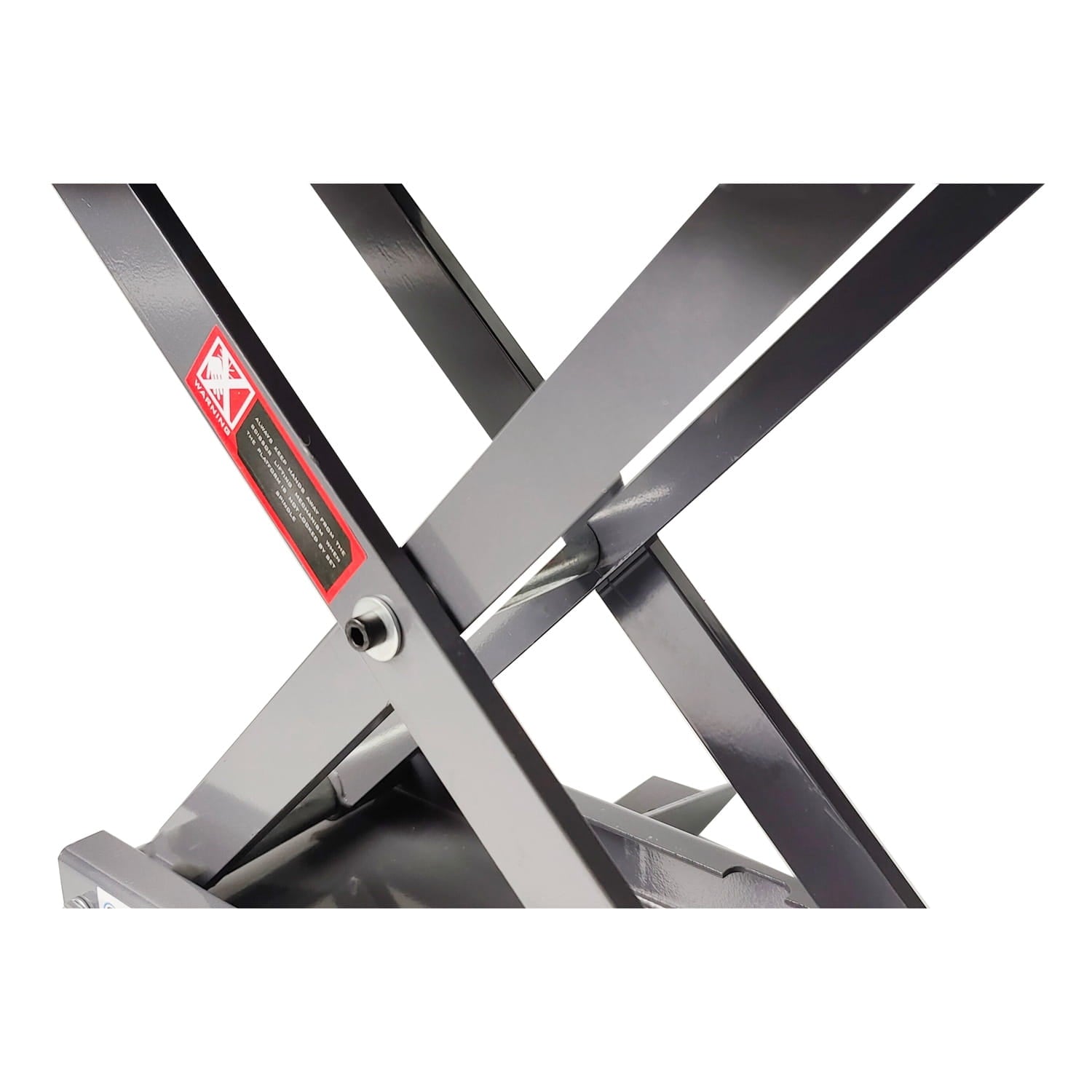 Metal motorbike scissor lift with a warning label on a white background