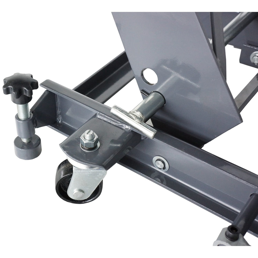 Close-up of a metal mechanical component from a hydraulic motorcycle lift on a white background