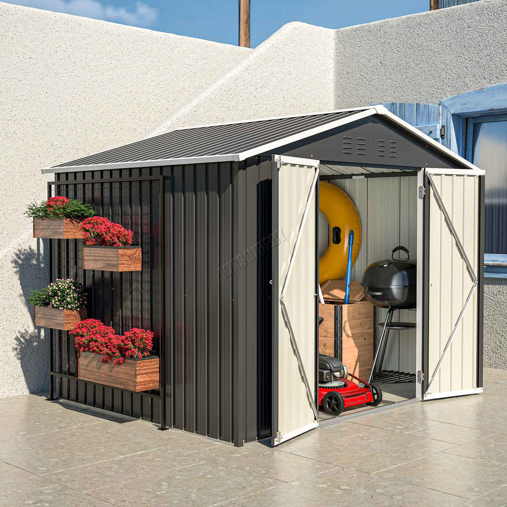 Side view of anthracite garden shed with apex roof and open doors on a sunny background.