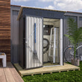 Small storage garden shed with pent roof and tools and a bicycle outside on a sunny day.