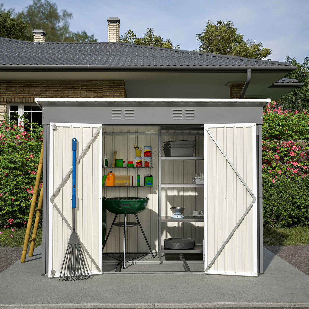 Grey garden shed with a pent roof with open doors and garden equipment inside.