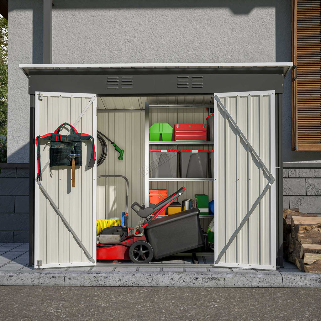 Anthracite garden shed with pent roof and open doors showing garden equipment, in front of grey house.