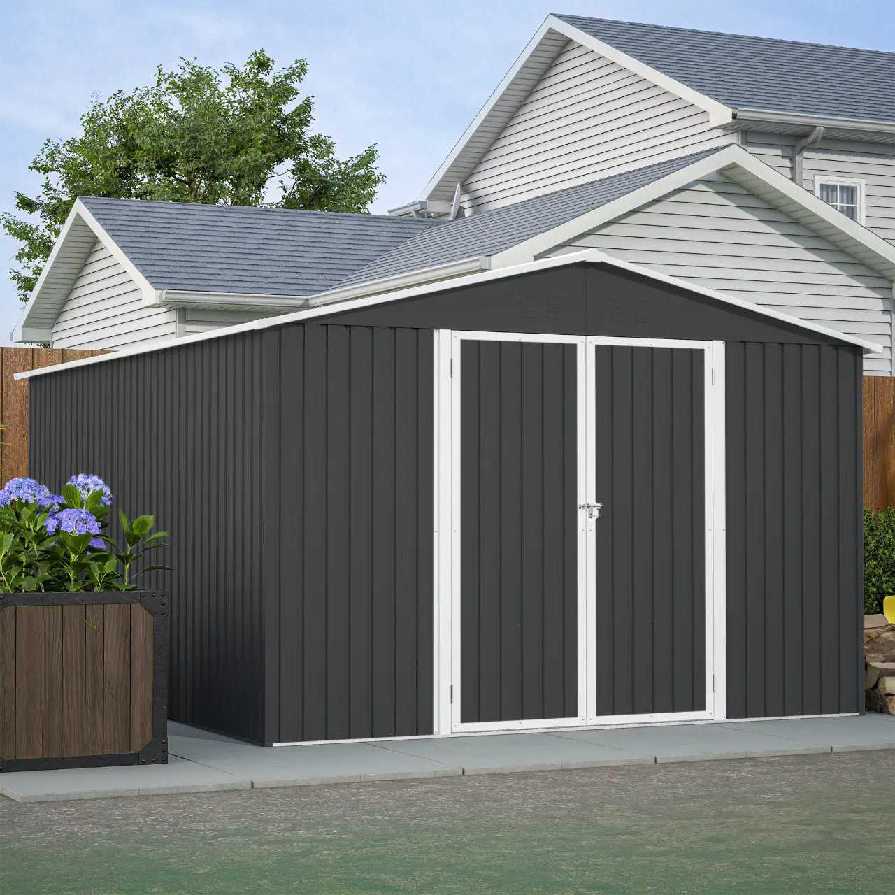 Anthracite metal garden shed with an apex roof in a backyard setting.