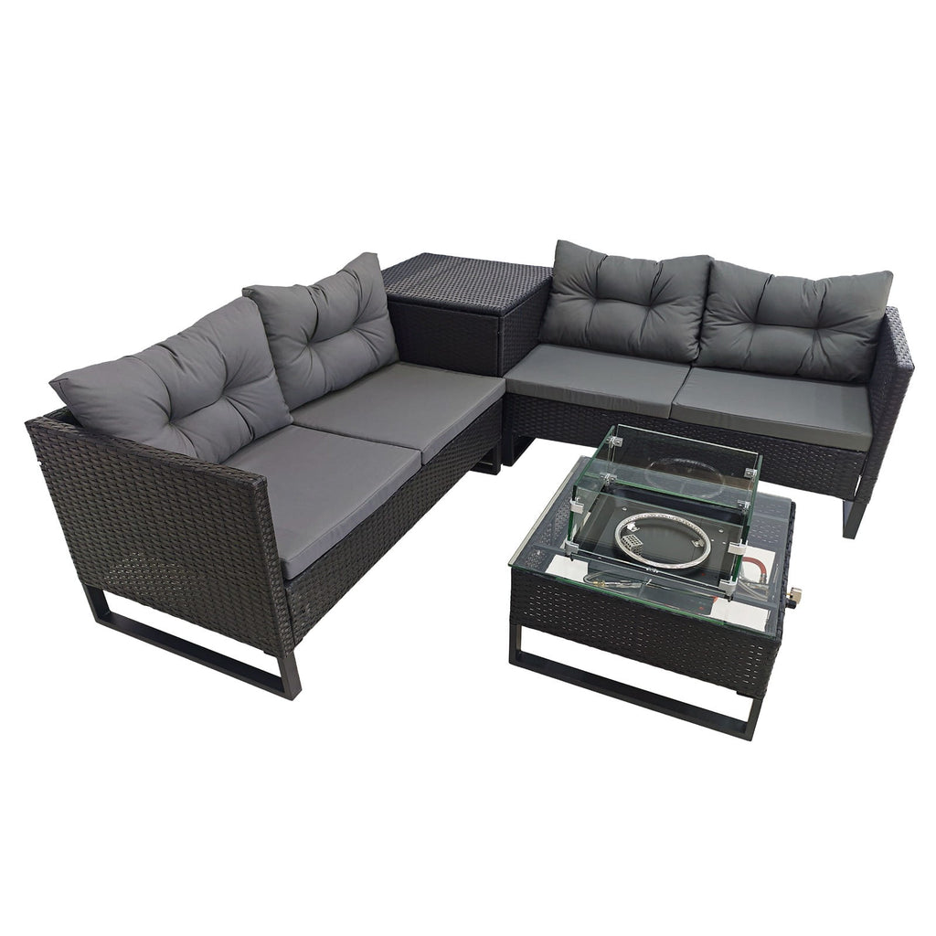 Rattan furniture set with central outdoor fire pit table.