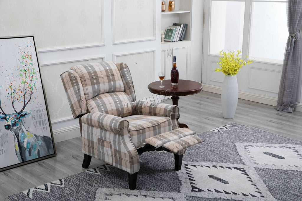 Beige checkered recliner armchair in a living room setting with a side table and decor items.