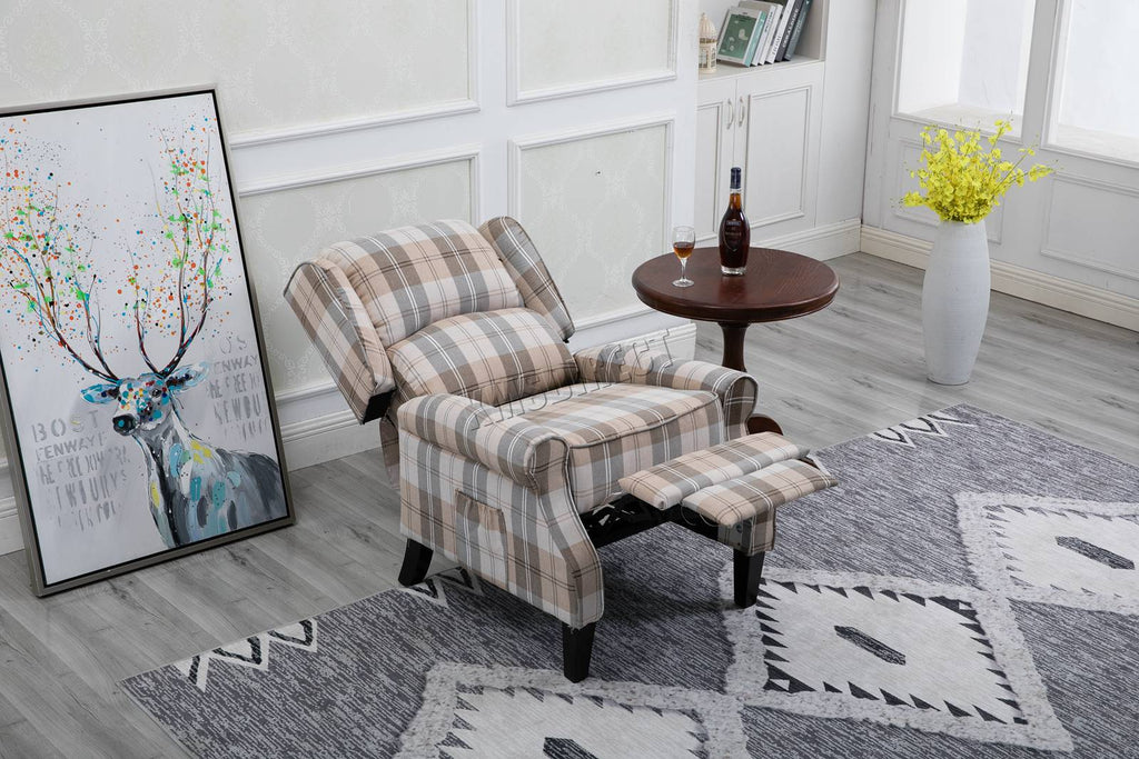 Beige checkered recliner armchair  in a room with a deer painting and a vase of flowers.
