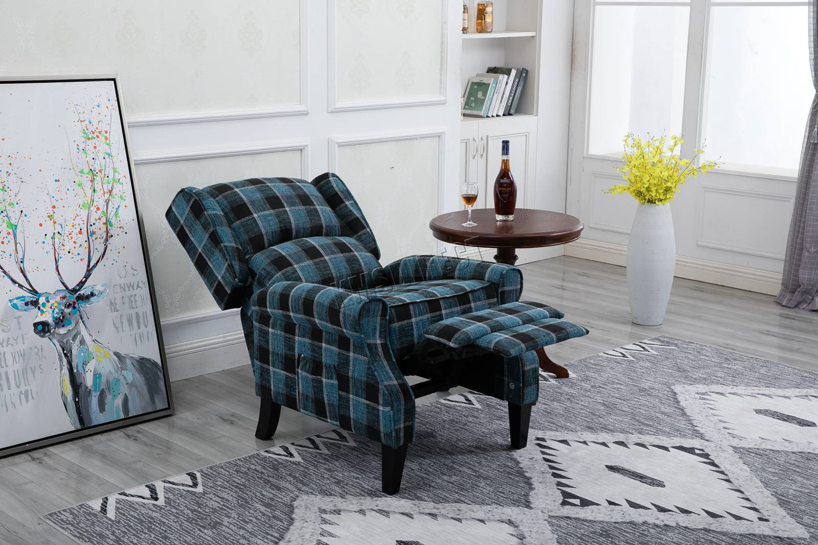 Blue checkered recliner armchair in a living room setting with a rug, table, and decorative items.