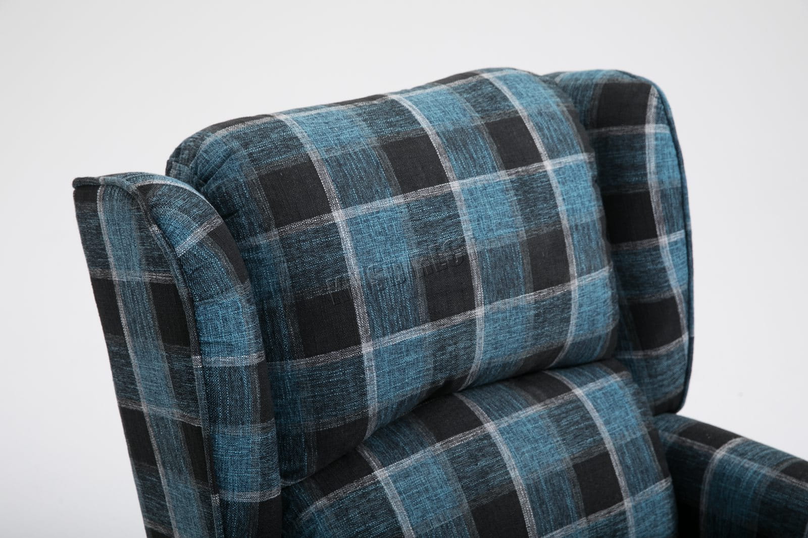 Blue checkered recliner armchair on a white background