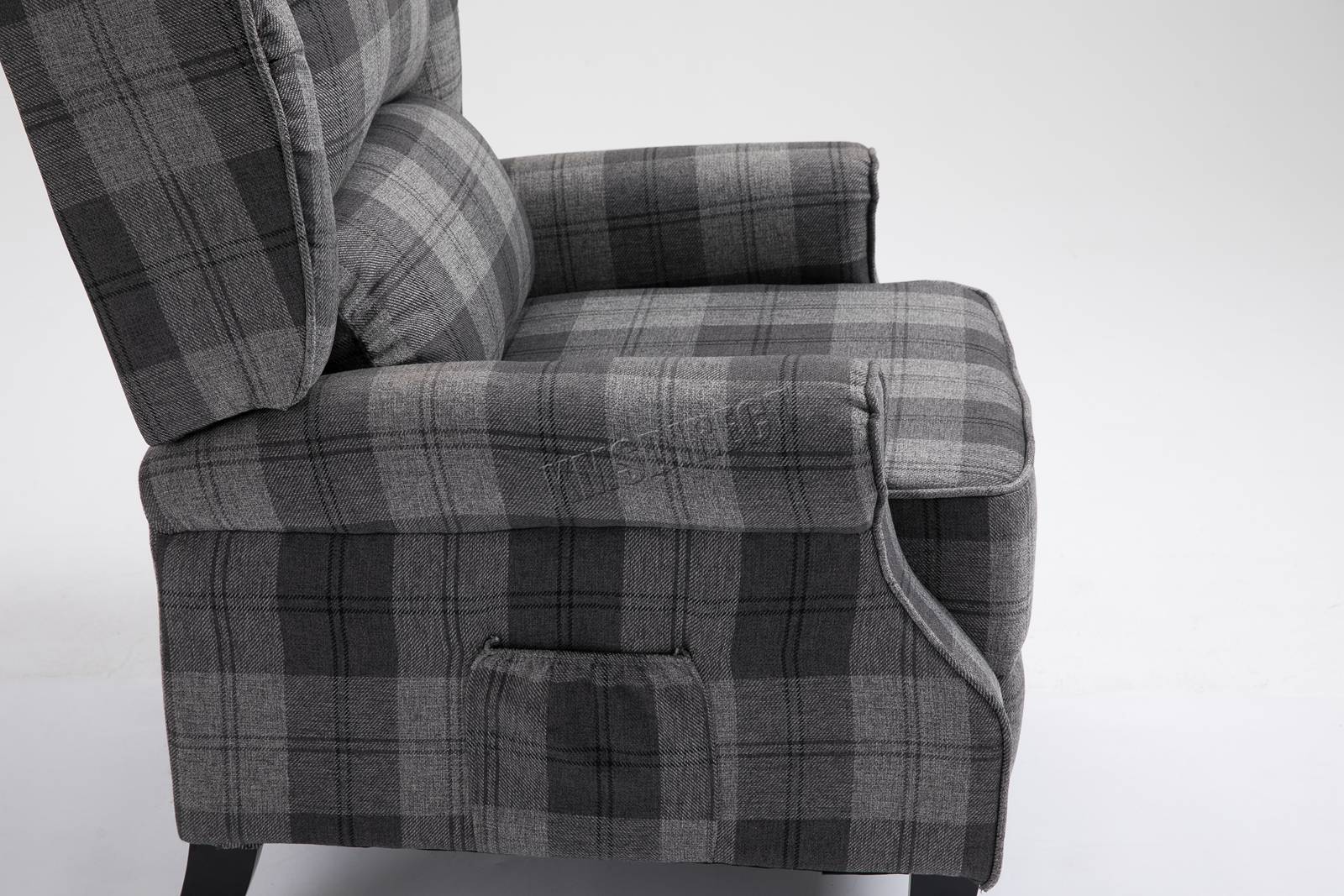 Grey checkered recliner armchair on a white background