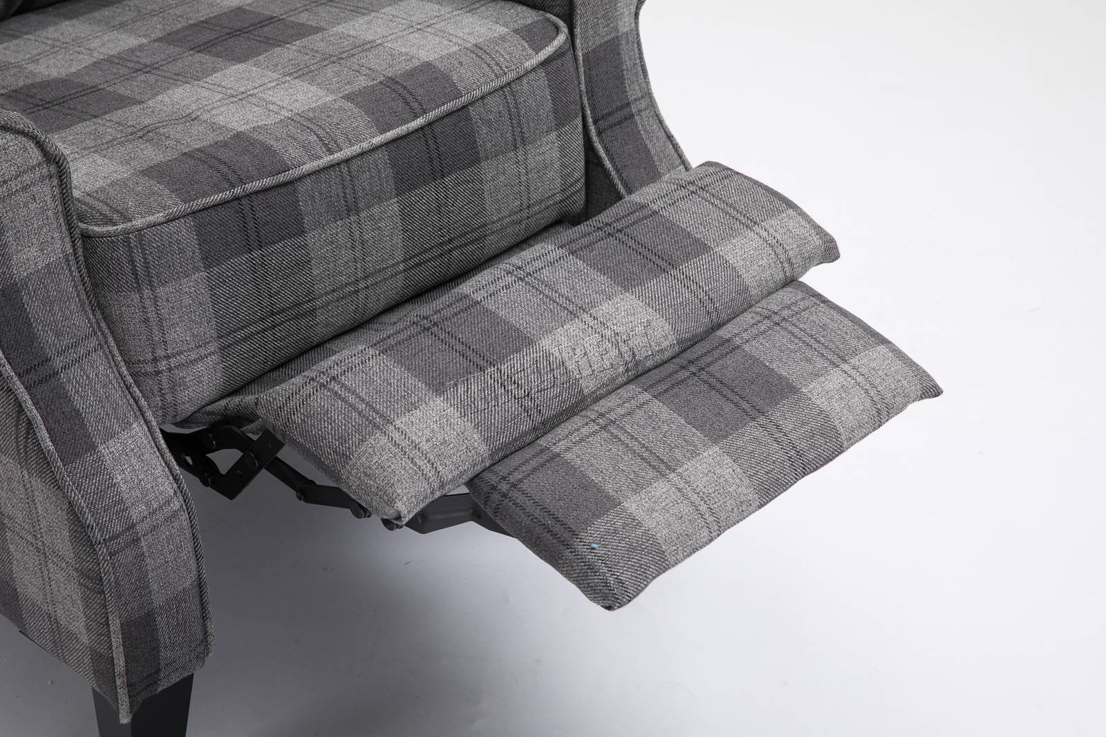 Grey checkered recliner armchair with reclining mechanism on a white background
