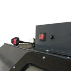 Close-up of a sandblasting machine with wiring on a white background