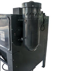 Black industrial sandblasting machine with a cylindrical component on a white background