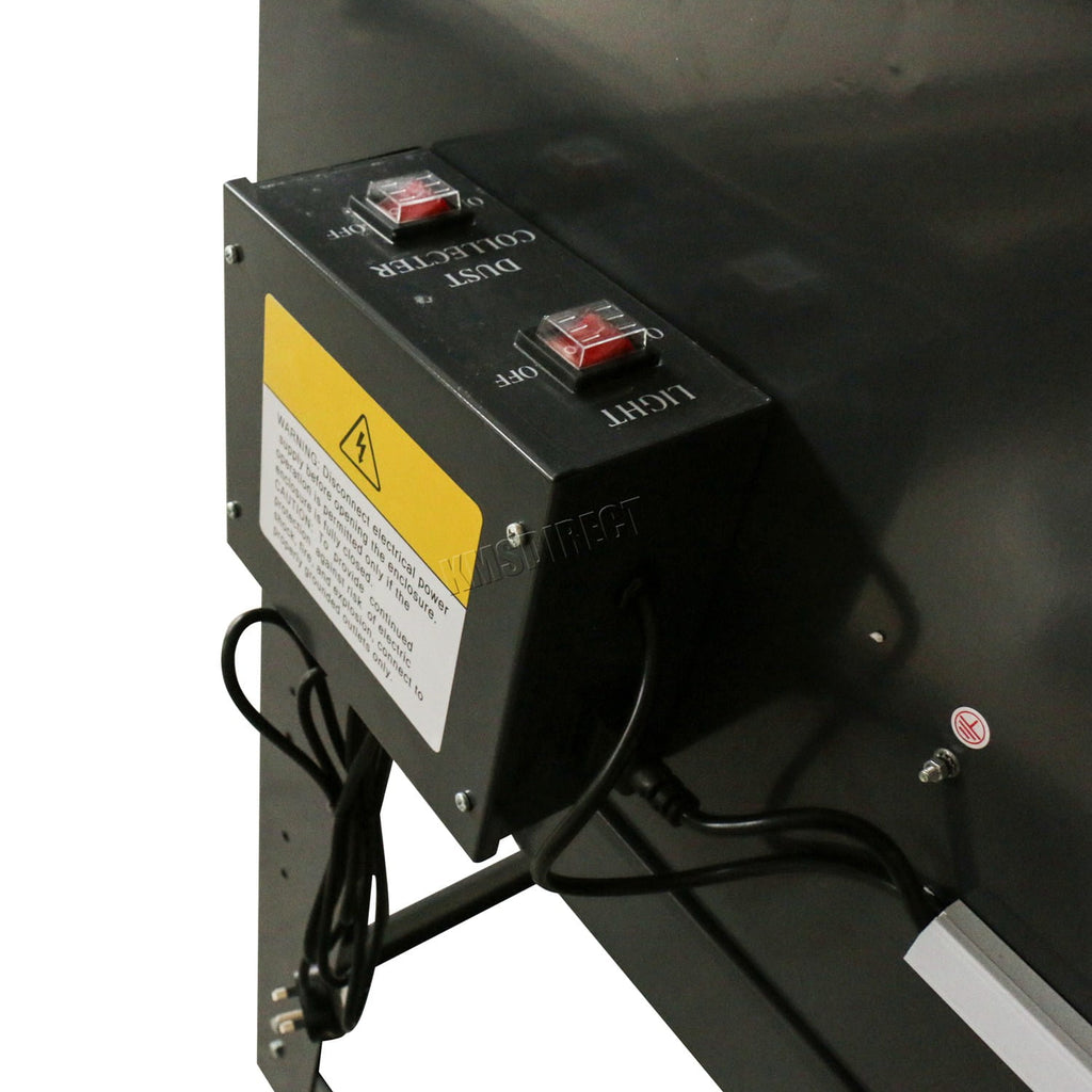 Control panel with switches and warning label from a sandblasting machine on a black surface