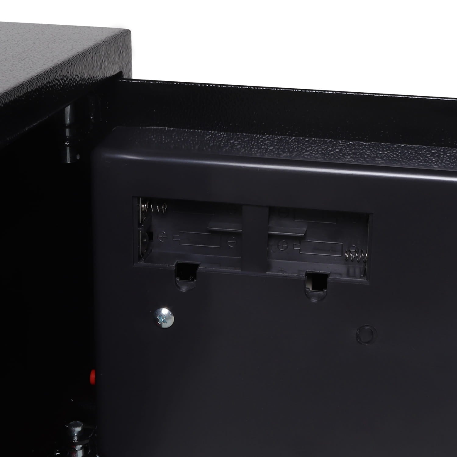 Close-up of a black electronic device with battery placement from a security safe on a white background