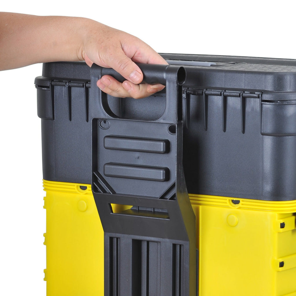 Hand holding a black and yellow stackable toolbox.