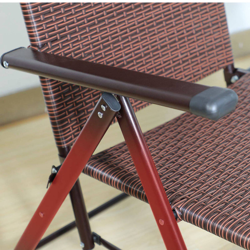 Zoomed in arm rest of a brown rattan outdoor recliner chair
