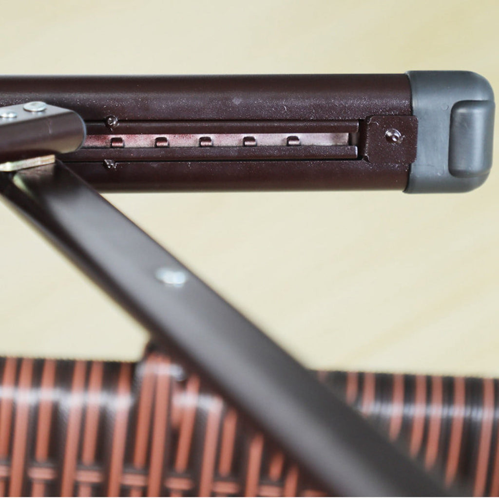Zoomed in photo of armrest underneath on a rattan outdoor recliner chair.
