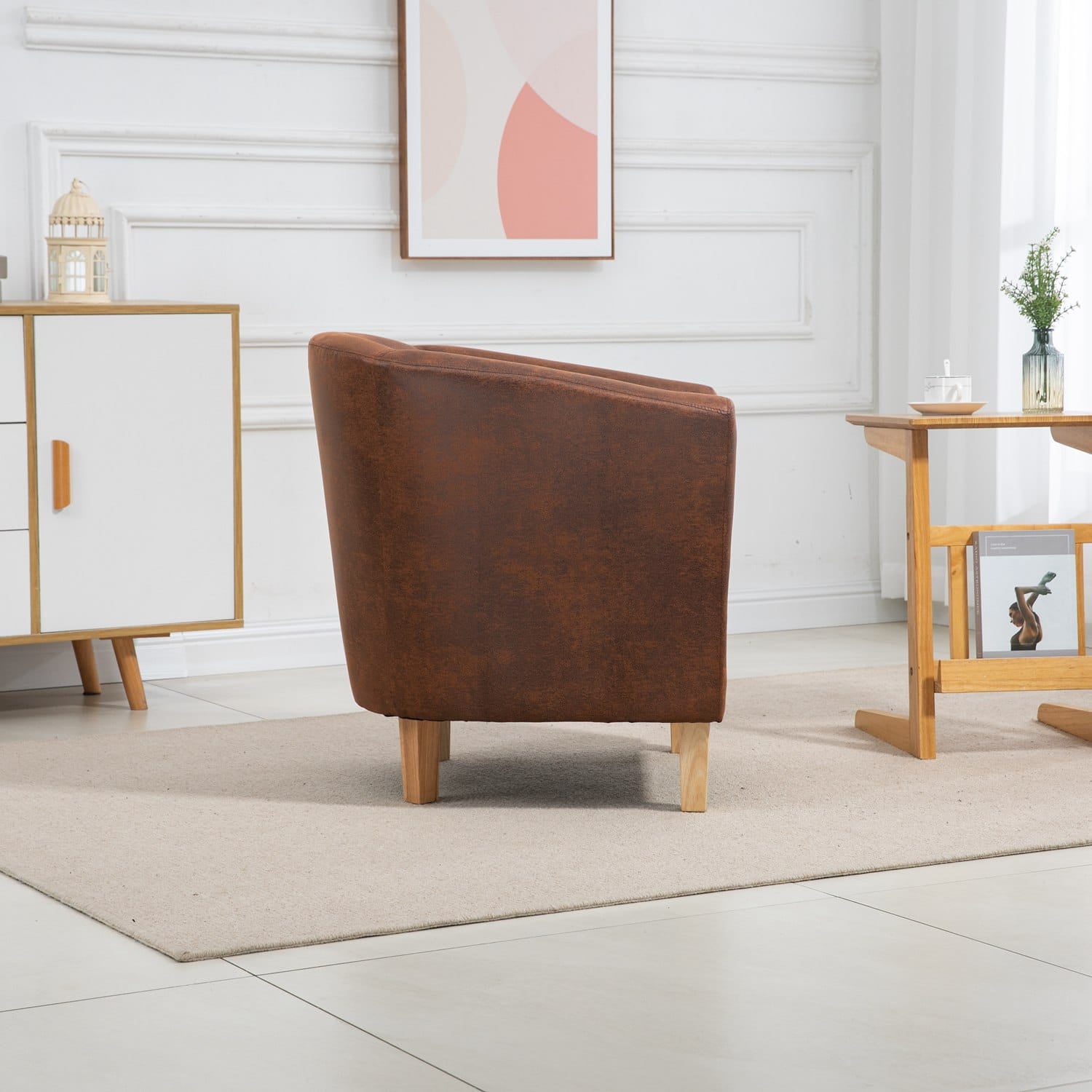 Brown faux leather armchair in a modern living room with white walls and minimal decor.
