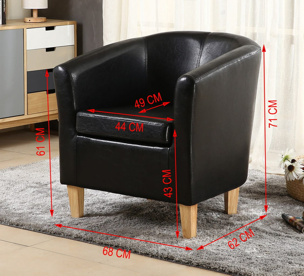 Black faux leather armchair with dimensions marked on a grey rug in a room setting.