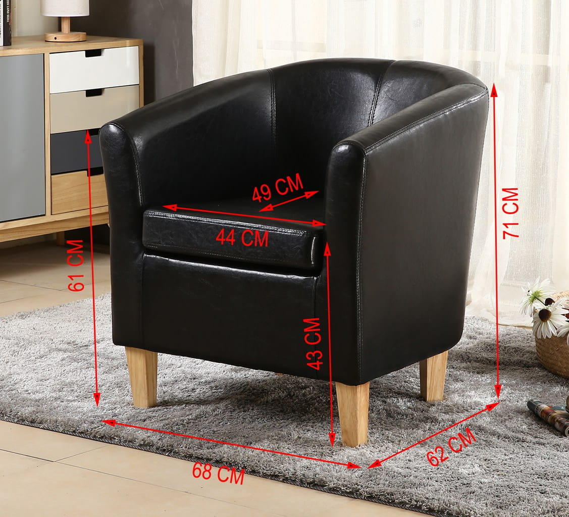 Black faux leather armchair with dimensions marked on a grey rug in a room setting.
