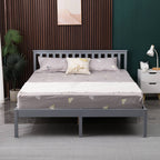 Grey wooden double bed frame with bedding in a bedroom setting.