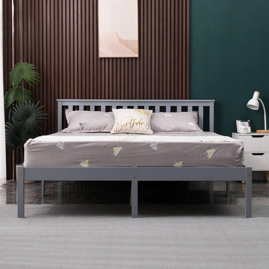 Grey wooden double bed frame with bedding in a bedroom setting.