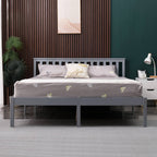 Grey wooden double bed frame with bedding in a bedroom setting.