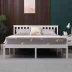 White wooden double bed frame with grey bedding in a bedroom setting.