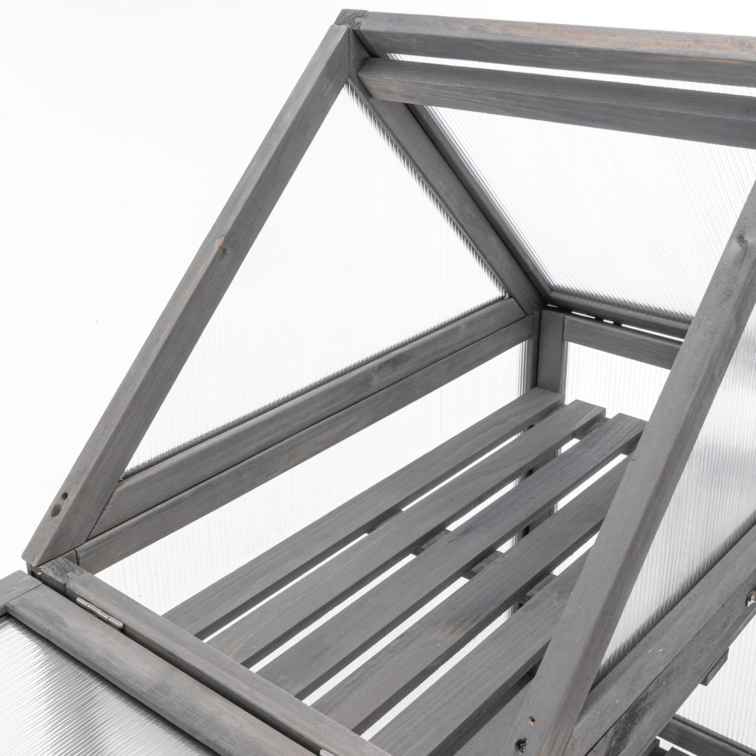 Grey wooden greenhouse frame structure on a white background