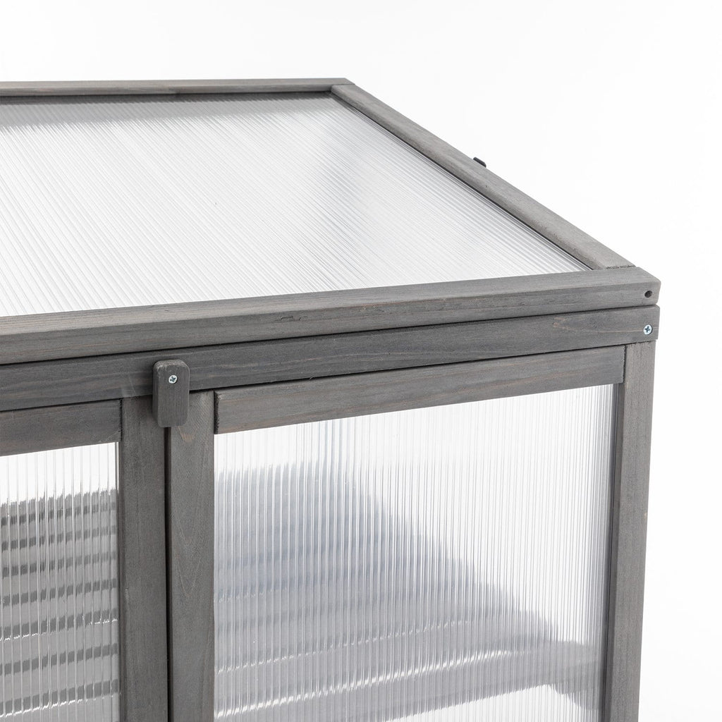 Wooden greenhouse with metal frame on a white background