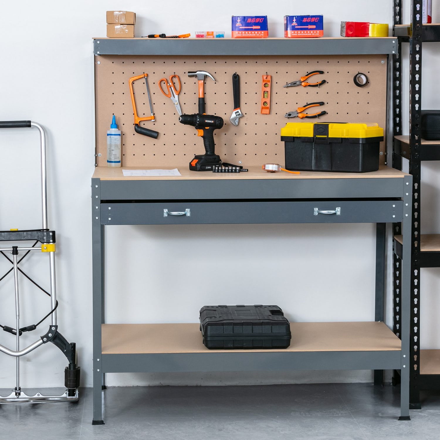 Workbench with tools and supplies against a white wall